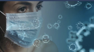 Woman wearing surgical mask amid graphical representations of viruses
