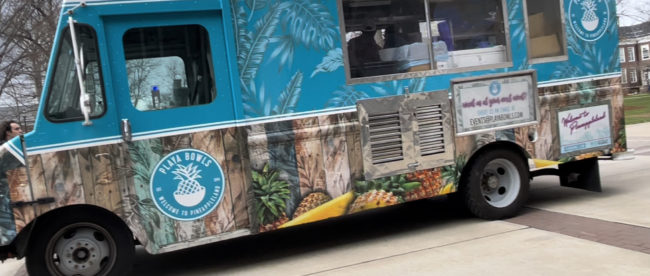 A blue Playa Bowls food truck